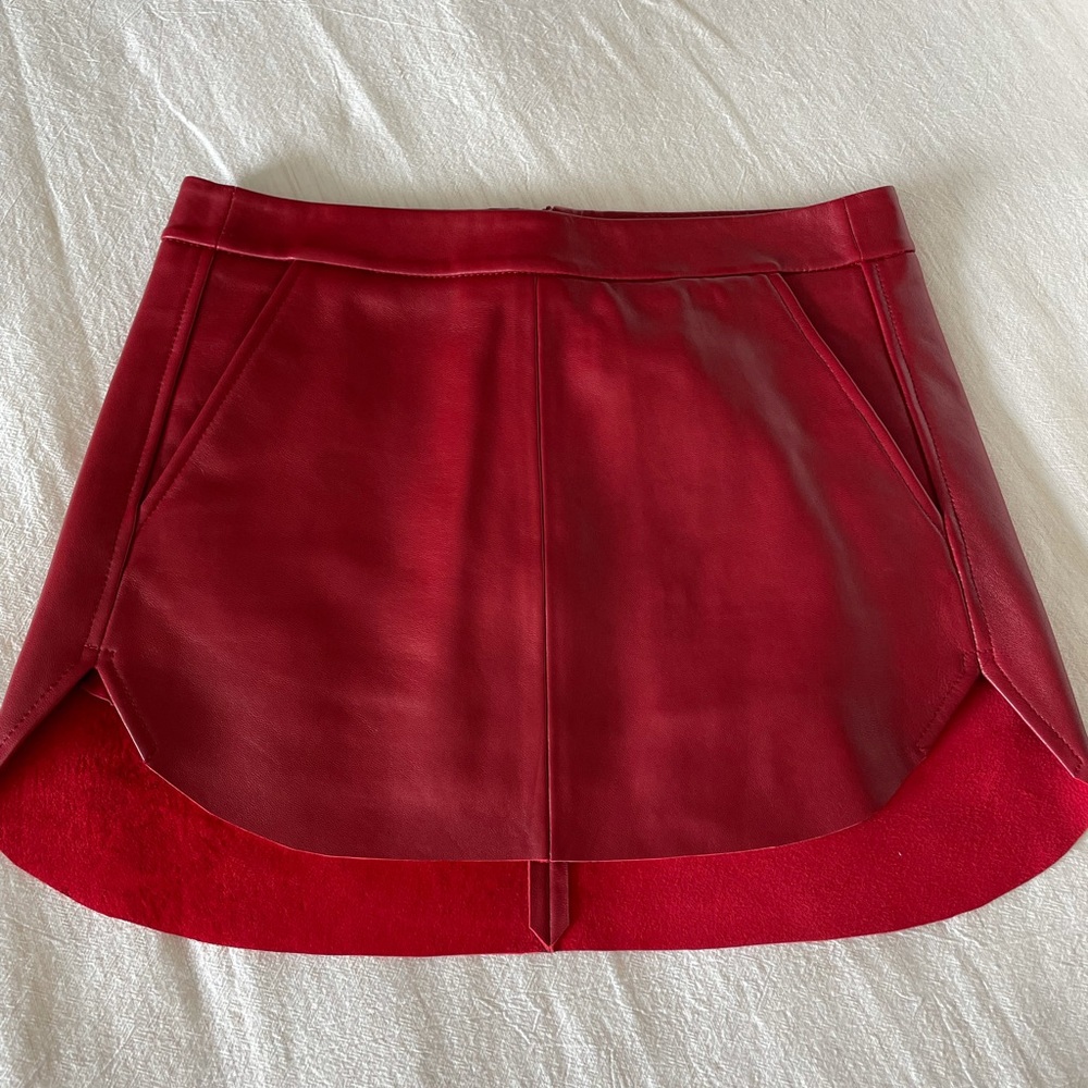 Michelle Mason red leather mini skirt.